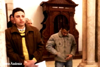 Ashes marketing on forehead of these two young men - Ash Wednesday Celebration in the Church of Nativity in Bethlehem, West Bank